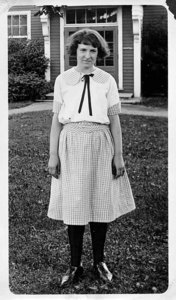 Homemaking Girl Showing Her Work with Clothing, about 1923