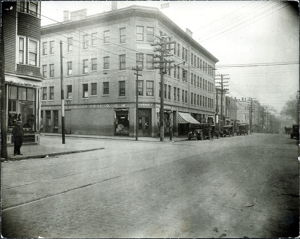 Lawrence St. west side at Elm St. looking north (2 copies); Lawrence St. Drug & Chemical Co.