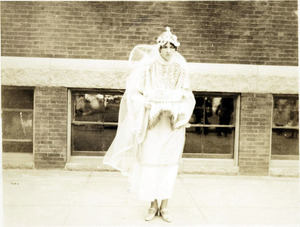 Young woman dressed as angel