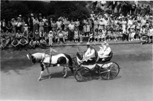 White suited men in pony cart