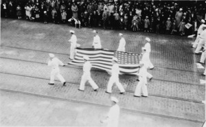 Sailors holding Large US flag