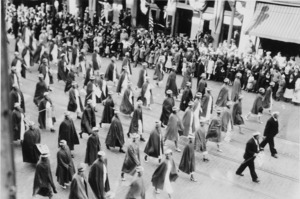 Nurses (?) wearing capes