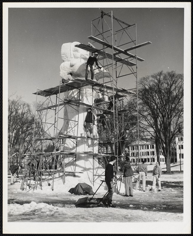 Dartmouth students building 35 foot ice statue "Fire and Ice," theme statue of 1957 Dartmouth College Winter Carnival.