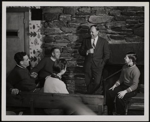 Sepp Ruschp (standing) telling a story in the Mt. Mansfield Toll House