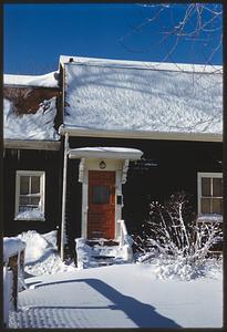 Snow outside entrance to a house