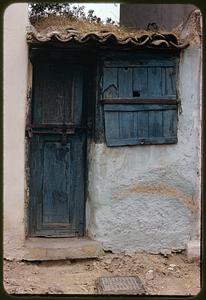 Door and window of stucco building, Athens, Greece