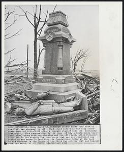 Pittsfield, Ohio – Monument Stands Alone – The base of the Civil War monument is all that stood intact in the tiny cross-roads town of Pittsfield after a tornado slammed into the community last night. Nine persons died in the town of 50, a dozen homes were demolished, along with two churches and the city hall, which formerly stood behind the statue. The one house that was not demolished was picked up and moves 50 feet from its foundation. Lying at the base of the monument is the figure of the Civil War solider that was toppled from the stand.