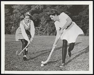 Former Ambassador’s Daughter a Candidate for Field Hockey Team. Philadelphia, Pa.-Patricia Ann Kennedy, former U.S. Ambassador to England, and a freshman candidate for Rosemont College girls’ varsity field hockey team, (right) is shown with Cathie Dives, last year’s co-captain who is out for her fourth season on the varsity, taking the ball down the field.