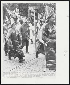 Klan Protest March--Klu Klux Klan marched in silent protest late this afternoon in St. Augustine, Fla. in protest to the civil rights bill. About 75, Klansmen in robs paraded to the slave market, scene of recent riots last week.