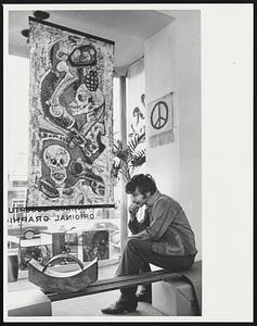 At Ward-Nasse Gallery on Newbury St. Moratorium oriented exhibit. Batik "Horror of war" by Brenda Minisci teaches at Amherst. Above, Peace symbol at Wall While young man is lost in thoughts (Lawrence Birnbach) of Boston.