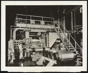 By Blaw-Knox-Tissue-thin aluminum foil comes out of this Blaw-Knox rolling mill at the rate of 3,000 feet a minute. [illegible]e foil can be squeezed down to one-tenth the thickness of th[illegible] of paper this picture is printed on.