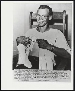 Shot in Strike Disorder - Richard Courtney, 19, Covington, shows where he was wounded slightly today in a shooting at the Decoursey yards of the strikebound Louisville & Nashville railroad. Courtney, driver of a truck hauling L & N employs through a picket line, was one of four wounded. He and two other men later were charged with shooting to kill.