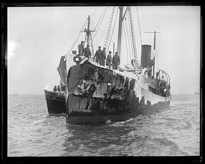 People standing on a ship covered in ice