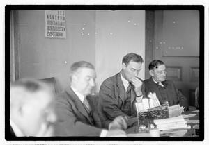 Group of men at table