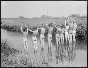 September morning on Dorchester Mud Flats. Group of boys ready for a dip.