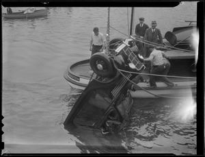 Auto plunges into harbor at army base