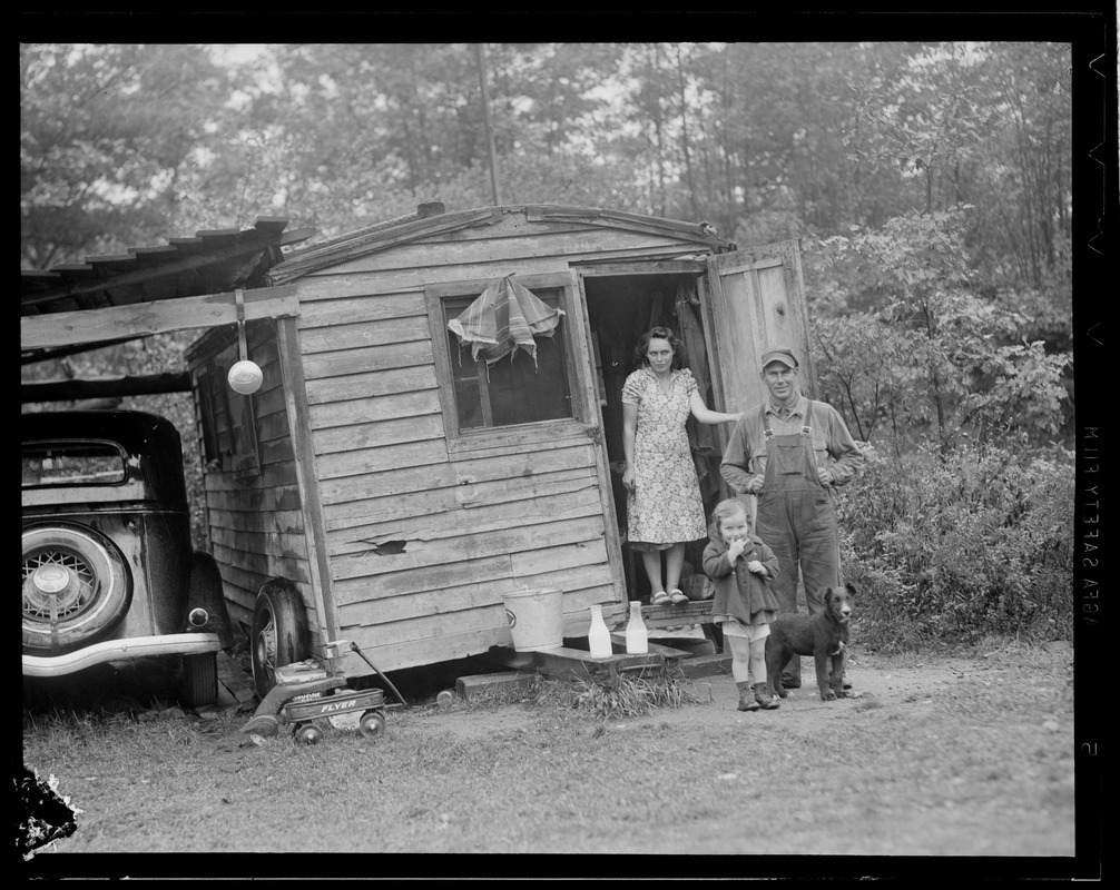 Mr. & Mrs. Lampi, daughter Ruth, 2 1/2, with dog "Nigger" living near the mill at Long Pond in West Rutland