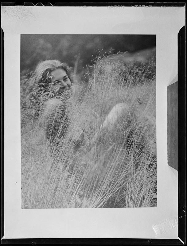 Nude woman in grass