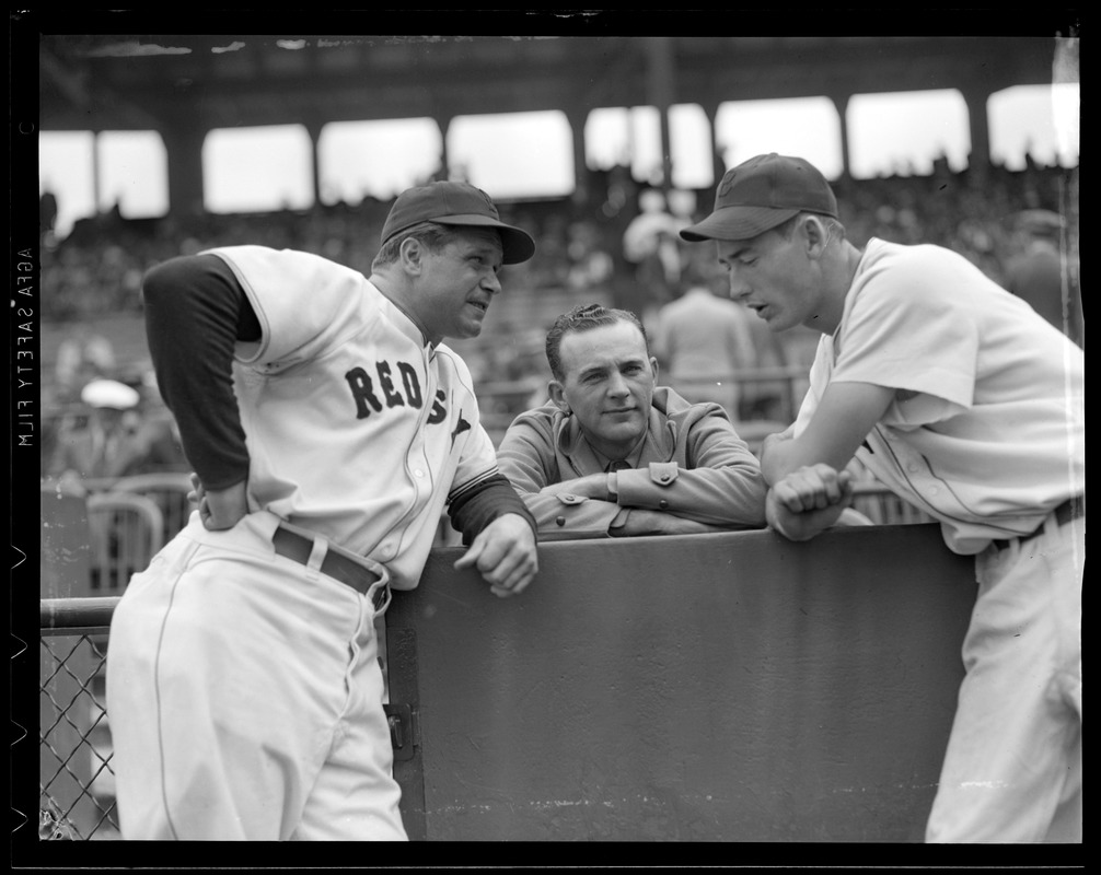 Jimmie Foxx and Ted Williams talk with man in stands at Fenway