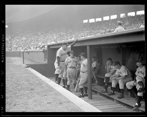 Yankees in dugout during game at Fenway
