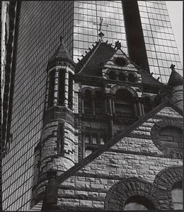 Detail of Trinity Church tower with Hancock Tower in view, Boston