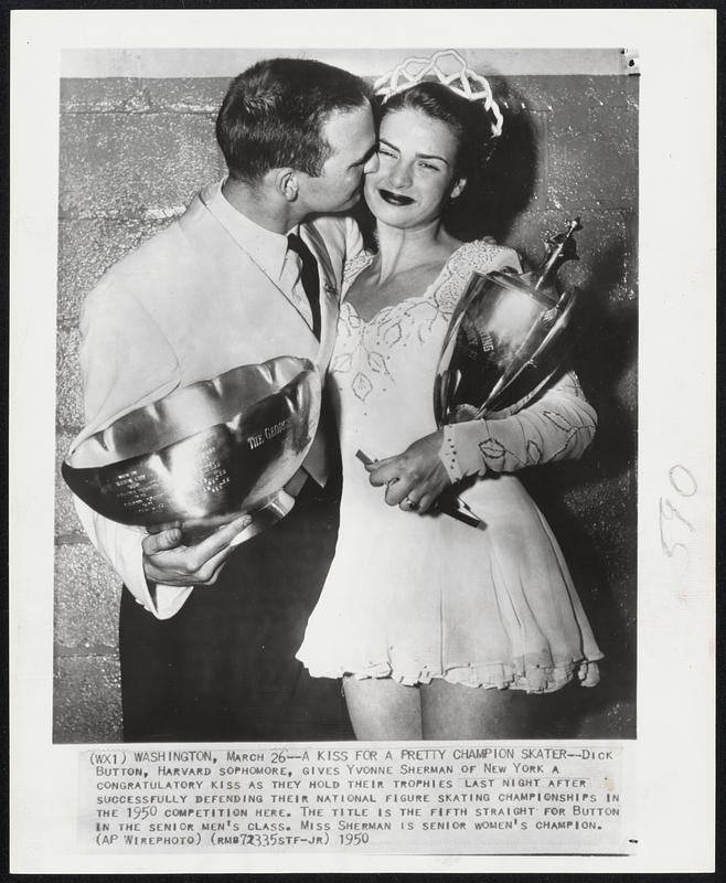 A Kiss for a Pretty Champion Skater--Dick Button, Harvard sophomore, gives Yvonne Sherman of New York a congratulatory kiss as they hold their trophies last night after successfully defending their national figure figure skating championships in the 1950 competition here. The title is the fifth straight for Button in the senior men’s class. Miss Sherman is senior women’s champion.