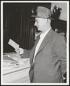 Genial Burt Shotton, Brooklyn manager, dutifully reads and answers all his fan mail.