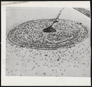 Ice Anglers - More than 5000 winter fishermen chiseled holes in White Bear lake ice to compete in the St. Paul winter carnival fishing derby. The tournament design, a four leaf clover (inside circle), emblem of the 4-H Club, rural youth organization, was jammed beyond capacity.