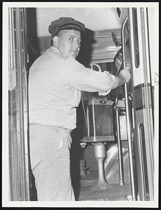 Ready To Roll – Driver Joe Arsenault climbs into cab of his MTA bus yesterday for his first run from City Square to Everett after settlement of the one-day strike which affected 250,000 commuters.