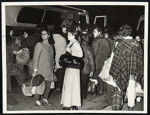 Washington-bound war protesters board buses at Harvard Stadium.