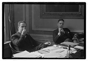 Two men seated at a desk