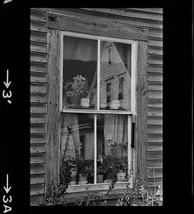 Reflections of homes in windows, Monhegan Island, Maine