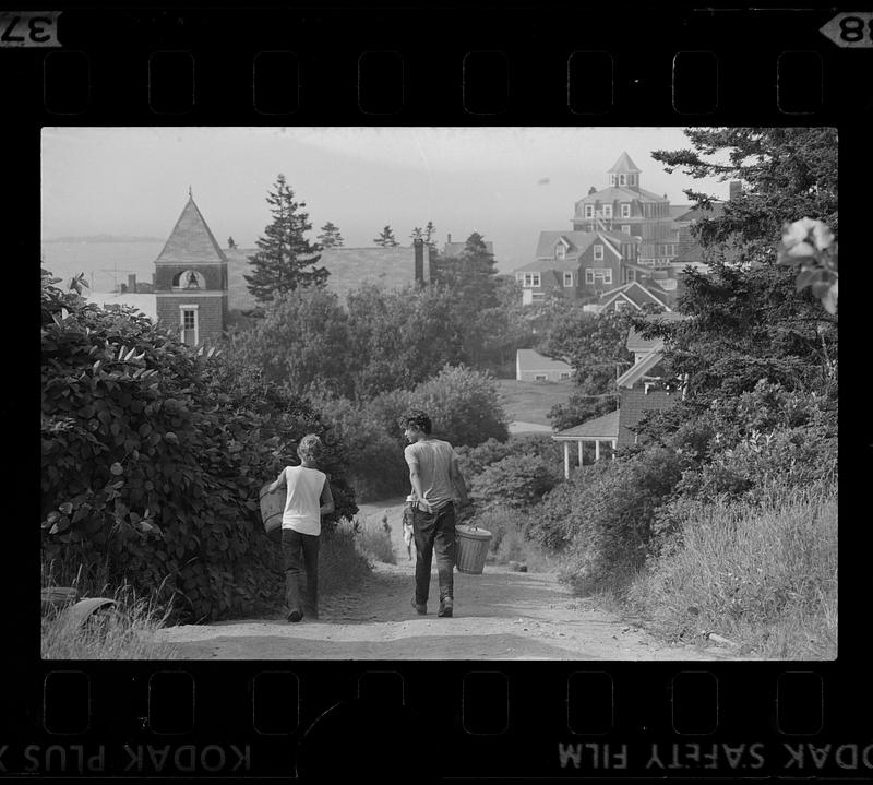 Boys walk down path near the Island Inn Hotel, Monhegan Island, Maine