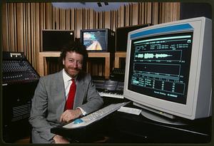 Audio technician and sound editing program on computer CRT monitor, Boston