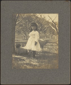 Langford Warren standing in field with sheep