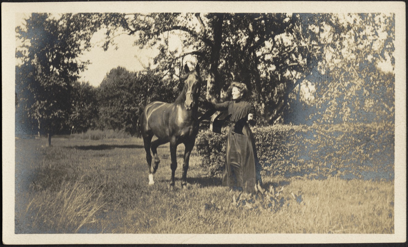 Gertrude S. Kunhardt with horse in garden, Ashdale Farm.
