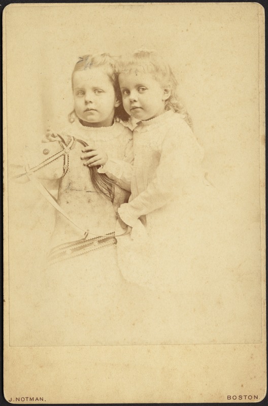 Isabel and Helen Stevens (twins) with rocking horse