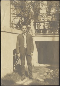 John Gardner Coolidge standing in front of building