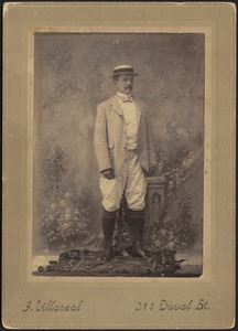 Studio portrait of John Gardner Coolidge wearing straw hat