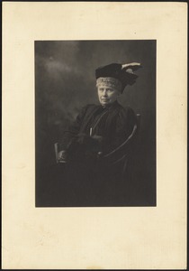 Julia Gardner Coolidge in dark dress with muff and hat with feathers