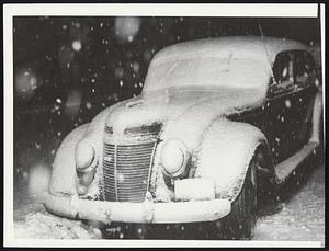 Car covered in snow