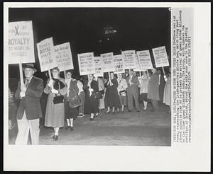 Queen Mother Gets Their Irish Up-These men and women, representing the Irish-American Minute Men, march along West Street opposite Pier 90 to protest the arrival of Queen Mother Elizabeth on the liner Queen Elizabeth today. The group, which opposes the partition of Ireland, struck the only sour note in the greeting ceremonies.