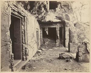 View from the left looking along interior of verandah of Buddhist chaitya hall, Cave XXVI, Ajanta, entrance doorway in left foreground, and "chapel" at right