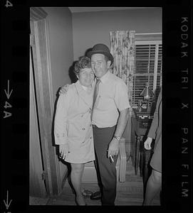 Man with bowler hat and woman celebrating Byron Matthews on election night