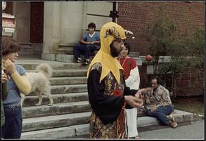 Jester juggling on steps of Lawrence Library