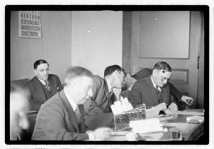 Group of men at table