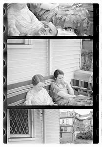 People, including Maude Sanromá, seated on a porch