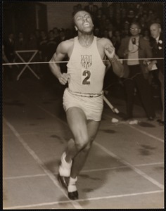 John Baricom smashing across the line in his record 1m 49.8s half-mile.