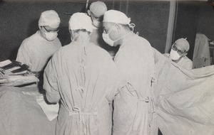 Five surgeons performing an operation at Faulkner Hospital