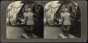 French gunners adjusting large cannon mounted on railway track - France